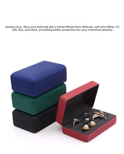 Macro view of portable microfiber jewelry boxes showing multiple colors and ring slots