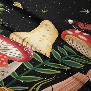 Close-up of soft flannel mushroom tapestry fabric with detailed magical forest print