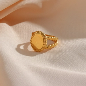 Retro 18K gold plated stainless steel rope ring with oval signet on beige silk background