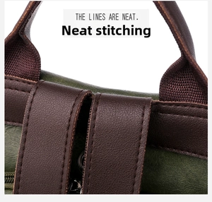 Detail view of neat stitching on dark green frosted leather and brown straps of the backpack
