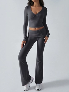 Detail of dark grey slim fit knit lounge set showing V-neck top and flared pants