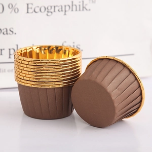 Close-up of brown disposable baking cups with gold rolled rims for heat-resistant muffins