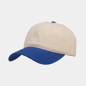 Detail of vintage beige and blue cotton twill baseball cap stitching and texture