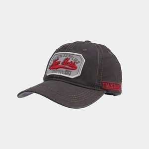 Detailed embroidery of New York text on dark cotton twill baseball cap texture