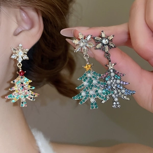 Detailed view of Christmas tree tassel earrings with crystal snowflakes and hanging pearls