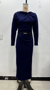 Detail of navy blue pleated dress featuring a knotted neckline and slim waist belt