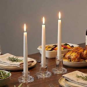 Elegant set of three clear glass taper candle holders for wedding tabletop decoration