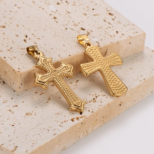Embossed stainless steel gold cross pendants for DIY jewelry making on stone pedestal
