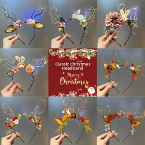 Detail showing various luminous Christmas antler headbands with LED lights and berries