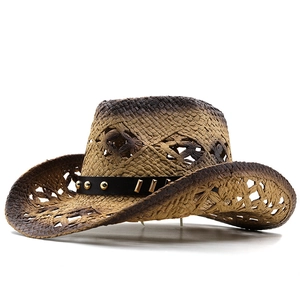 Detail of western straw hat featuring hollow weave patterns and studded leather band