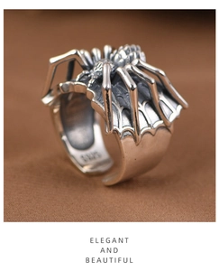 Macro detail of vintage punk spider ring showing S925 hallmark and textured silver finish