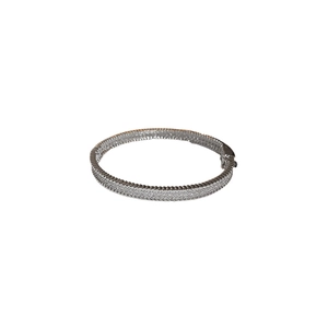 Elegant silver zircon pave bracelet with minimalist textured metal edges on white background