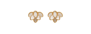 Close-up of elegant gold rimmed white enamel flower earrings in vintage french style