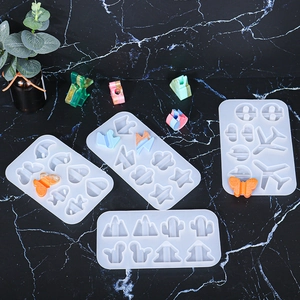 Flat lay of DIY silicone molds for resin crafts featuring clouds stars and moon shapes