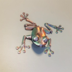 Detailed view of 3D printed articulated frog with metallic gradient color finish