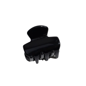 Classic black glossy hair claw clip with a polished finish on a white background