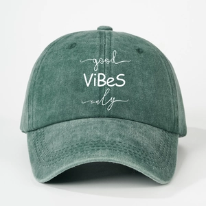 Detailed view of the embroidered Good Vibes Only text on washed vintage cotton baseball cap