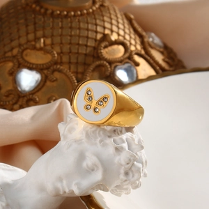 Detailed shot of 18K gold plated ring featuring a butterfly motif and sparkling zircon stones