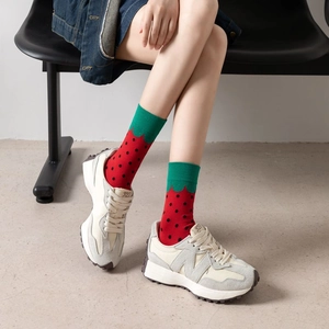 Vibrant red strawberry pattern cotton socks with green scalloped cuffs for men and women
