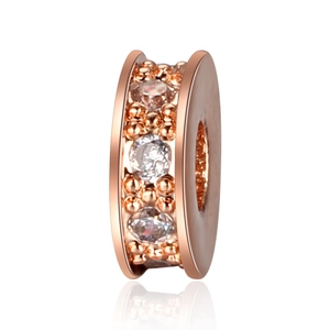 Macro shot of rose gold plated spacer beads with inlaid clear zircon for DIY jewelry