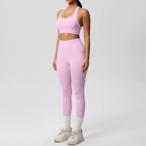 Detailed view of pale pink yoga set featuring side pocket on high-waist leggings