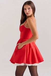 Detail of red satin dress with white mesh underskirt and hidden side pocket