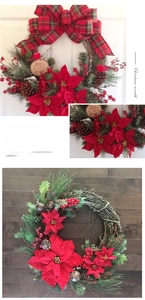 Detail of Christmas wreath featuring red poinsettia, pine cones, bells and Joy sign
