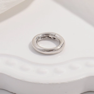 Close-up of polished S925 sterling silver round spring clasp for necklaces and bracelets