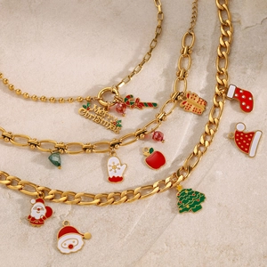 Detailed view of Christmas themed stainless steel bracelets with festive enamel charms