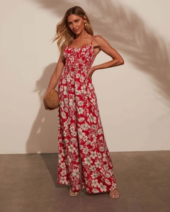 Detail of red floral print jumpsuit with elastic bandeau neck and lightweight fabric