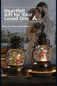 Close-up of vintage bronze Christmas lanterns with snow globe scenes and sparkling glitter