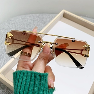Frameless rectangle sunglasses with gradient brown lenses and golden panther hardware
