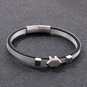 Detail of men's leather cord bracelet featuring silver mesh and a magnetic clasp