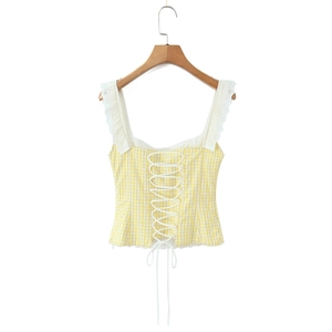 Detail of yellow gingham crop top featuring lace straps and front lace-up drawstring