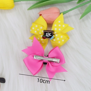 Two-piece bow hair clips set with ABC blackboard charm and colorful ribbed ribbon