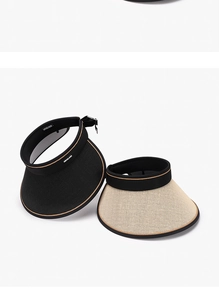 Detail of breathable woven sun visors in black and beige with adjustable buckles