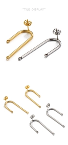 Detailed view of U-shaped gold and silver stainless steel earring hooks with butterfly backings
