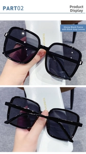 Close-up of KD97067 square oversized sunglasses with glossy black frames and grey lenses