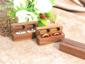Dual-slot walnut ring box with magnetic closure and premium red and white velvet lining