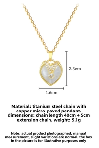 Detailed view of heart-shaped cat-eye pendant with gold titanium chain and crystals