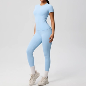 Detailed shot of seamless light blue yoga set with high-waisted leggings and fitted top