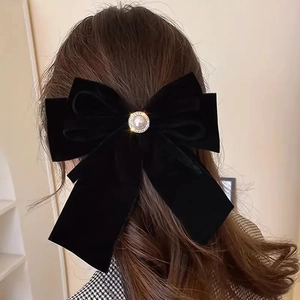 Elegant black velvet bow hair clip with pearl rhinestone center and long ribbon streamers