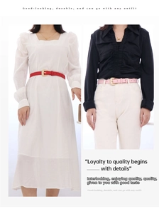 Detail of red and pink slim belts with gold buckles on white and black outfits