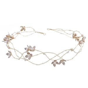 Elegant gold bridal headband with metallic flowers and white pearls for wedding hair