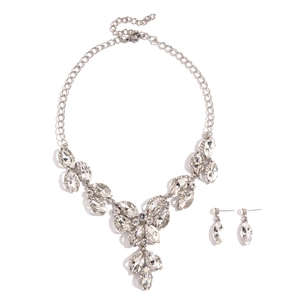 Elegant silver necklace and earrings set with marquise cut crystal leaf motifs on white