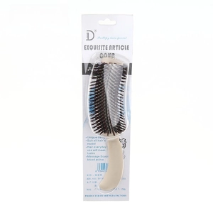 Detail of S-shaped volumizing hair comb with card packaging for professional styling