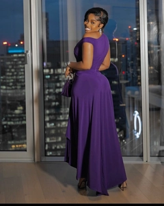 Detail of elegant purple one-shoulder evening gown with a slim waist and long length