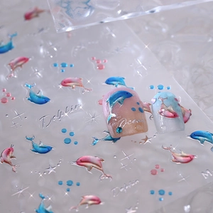 3D embossed dolphin nail art stickers with metallic silver edges and ocean theme motifs