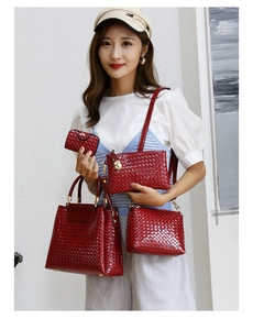 Red patent leather handbag set with woven texture including tote and crossbody bags