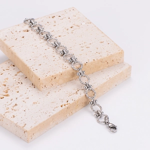 Punk style stainless steel O-chain bracelet with textured rings and polished silver beads